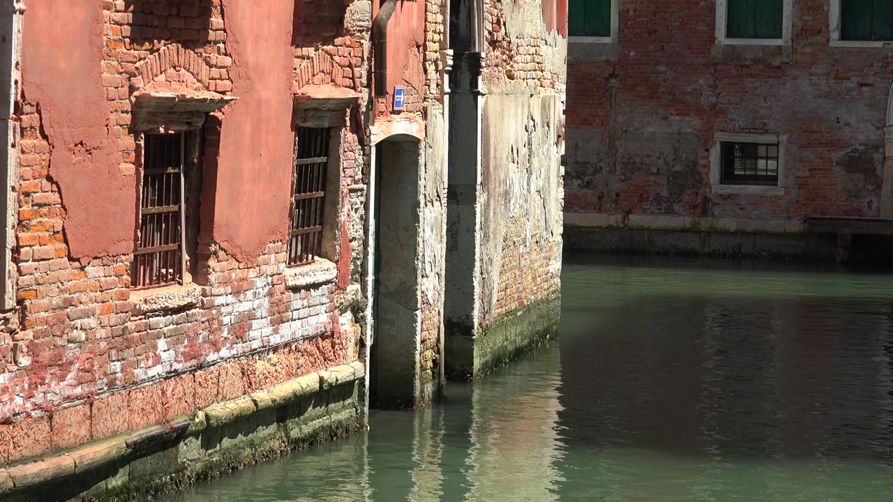 Old Brick Building Along a Canal in Venice