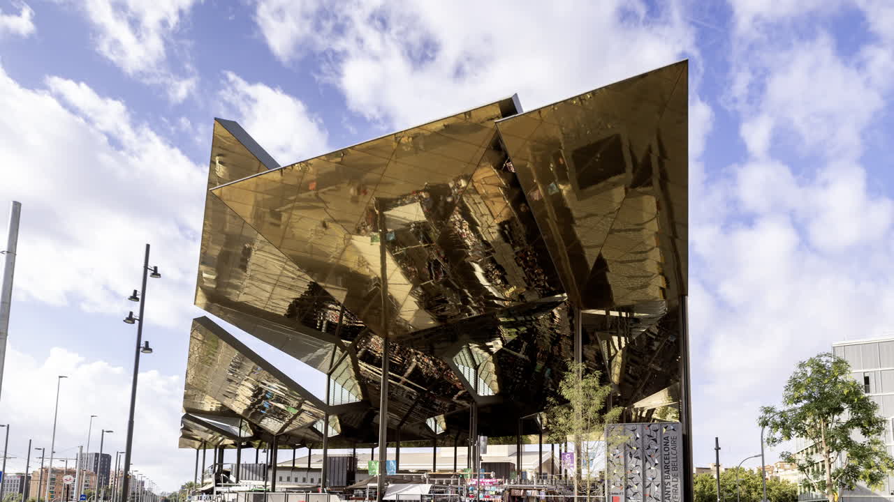 Timelapse of the encants second hand market with gloden reflecting roof in barcelona