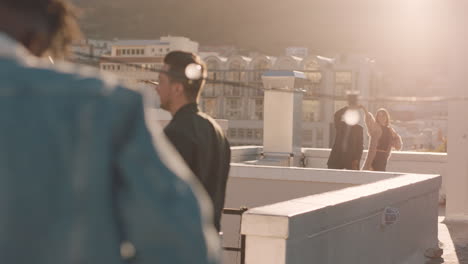 happy-young-multiracial-couple-dancing-on-rooftop-at-sunset-celebrating-relationship-having-fun-enjoying-playful-dance-together