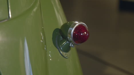 a brass tail light, lamp of an old, retro car