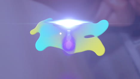 animation of green and yellow blob and moving spotlight over blurred background