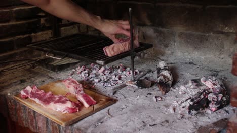 static shot of chef grilling meat, argentinian style