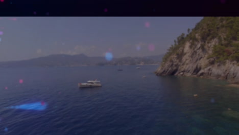 boats floating on calm sea near rocky coastline with animation overlay