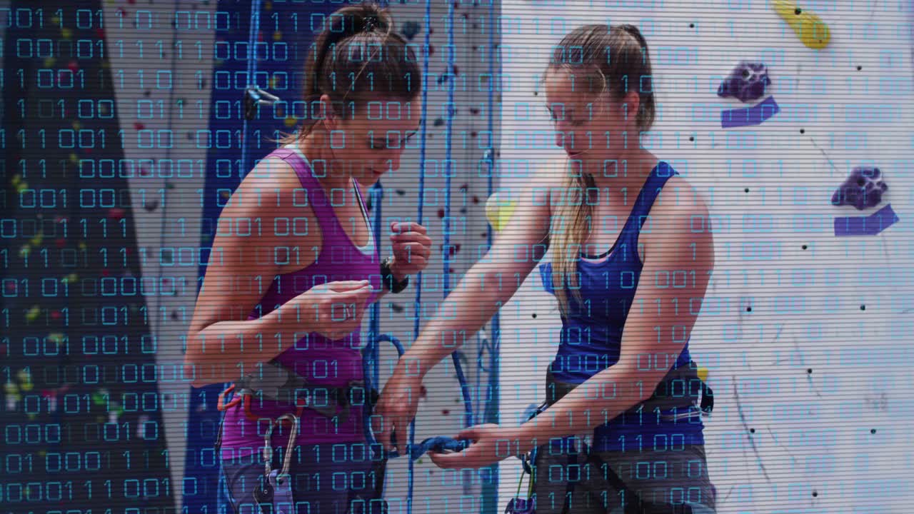 Climbing partners getting belay device threading rope locking carabiner testing lock readying climb