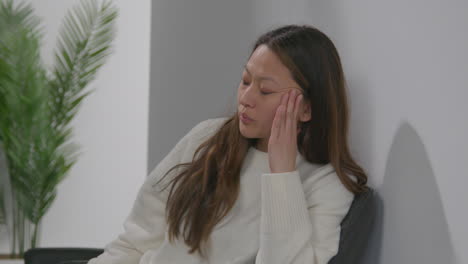 Stressed-Or-Anxious-Woman-At-Work-In-Office-Building-Reacting-To-Internet-Or-Social-Media-News-Message-Or-Story-On-Mobile-Phone