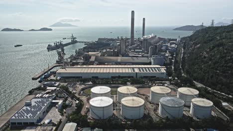 an aerial view of petrochemical industry in sunny morning , hong kong coal power station and oil tank of tuen mun