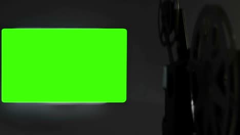 proyector de películas viejas con relación de aspecto 16 x 9 clave de croma fondo de pantalla verde y efecto parpadeo, estilo vintage