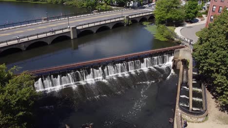 Approaching-over-the-Moody-Street-Dam-on-the-Charles-River-in-Waltham,-Massachusetts