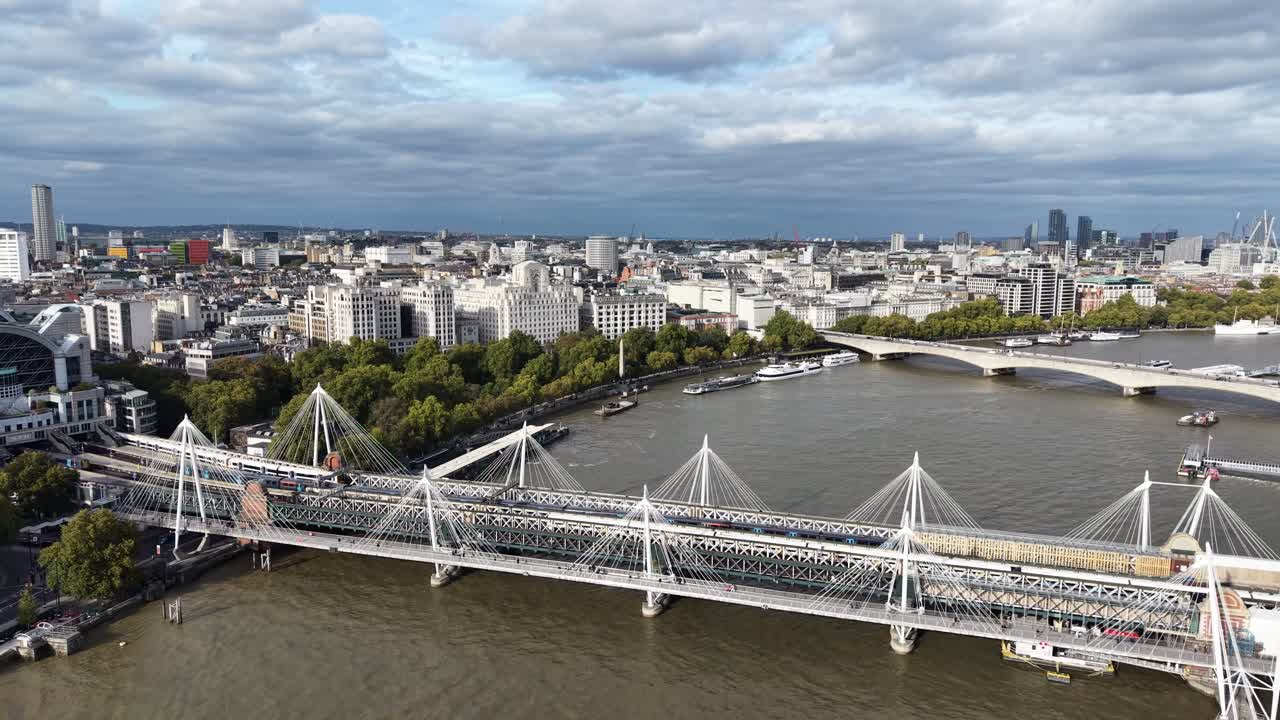 Hungerford Bridge and Golden Jubilee Bridges London UK drone,aerial