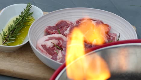 lamb chops on a bucket bbq , rosemary salt and olive oil