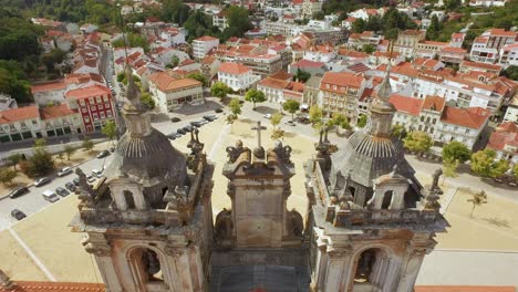 aerial view of a european town square and monastery