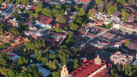drone flight over coyoacan historic center, cdmx, with a view of church rooftop