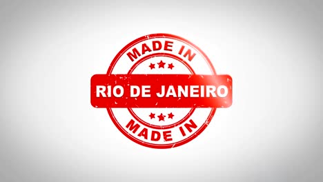 made in rio de janeiro signed stamping text wooden stamp animation. red ink on clean white paper surface background with green matte background included.