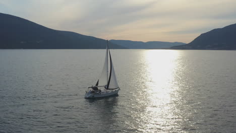 sailing yacht in the bay at sunset