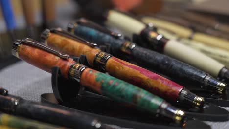 display of handcrafted pens on a table