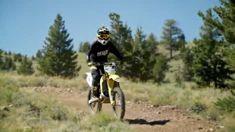 female dirt bike rider on trail