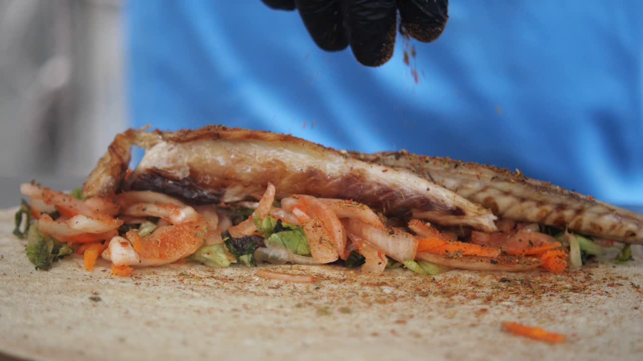 Delicious grilled fish sandwich with fresh vegetables