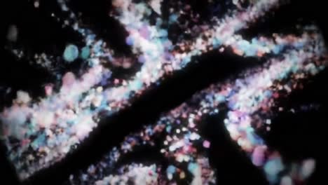 a stunning visual journey through abstract patterns of light and color, capturing the fluid dynamics of sparkling particles against a dark background