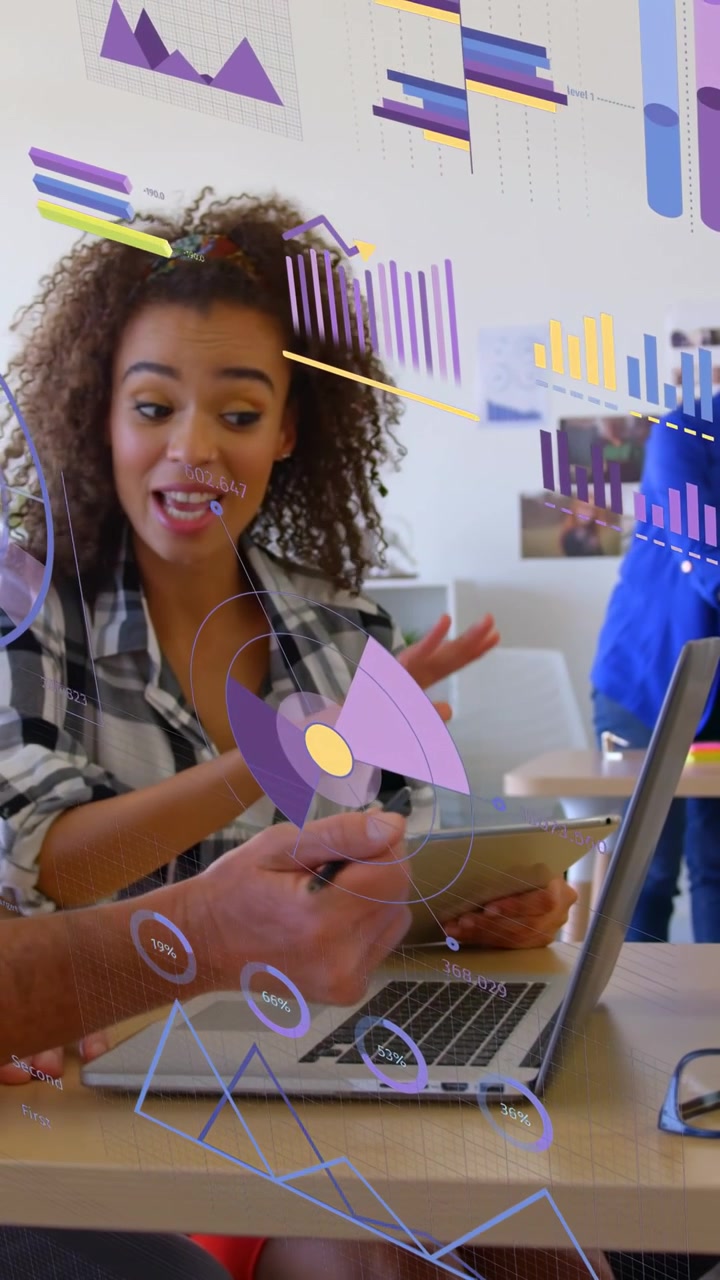 Vertical video: Woman responding to team tap, using tablet and analyzing AR design charts on laptop