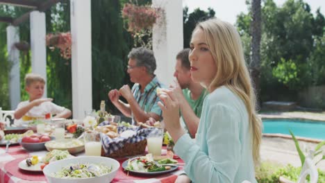 happy family eating together at table