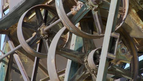 Old-cogwheels-rust-in-the-sun-at-an-abandoned-mine