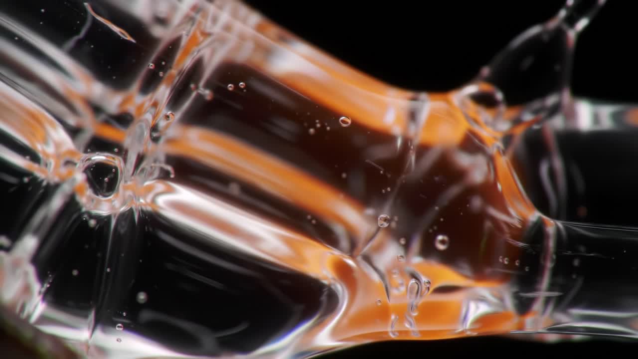 Captivating Fluid Dynamics: An Exploration of Viscosity and Motion Captured in Stunning Macro Imagery of Transparent Material Interacting with Vivid Colors