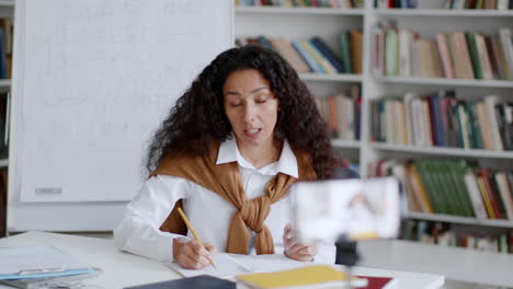 female teacher conducting online mathematics class from home studio