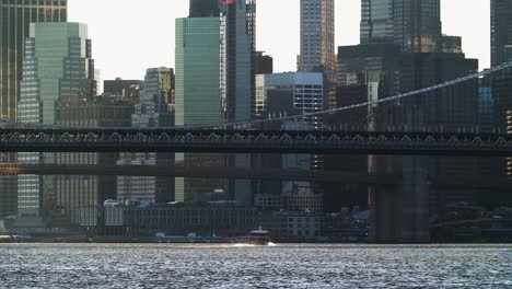 Zoom-in-on-commuter-boat-traveling-towards-Manhattan