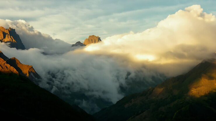 Dramatic Sunset Over Mountains with Clouds