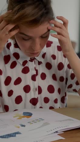 young student struggles with homework in a bright study space