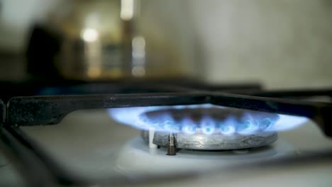 lighting a gas ring on the cooker hob