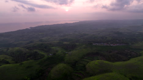 Flying-over-Nusa-Penida-at-sunset,-Bali-in-Indonesia