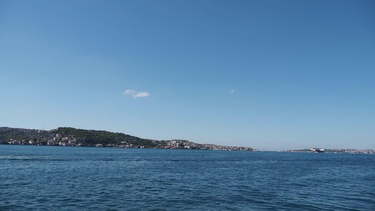 Coastal Landscape with Buildings and Blue Sky