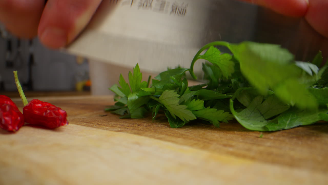 Chopping Parsley and Chili Peppers