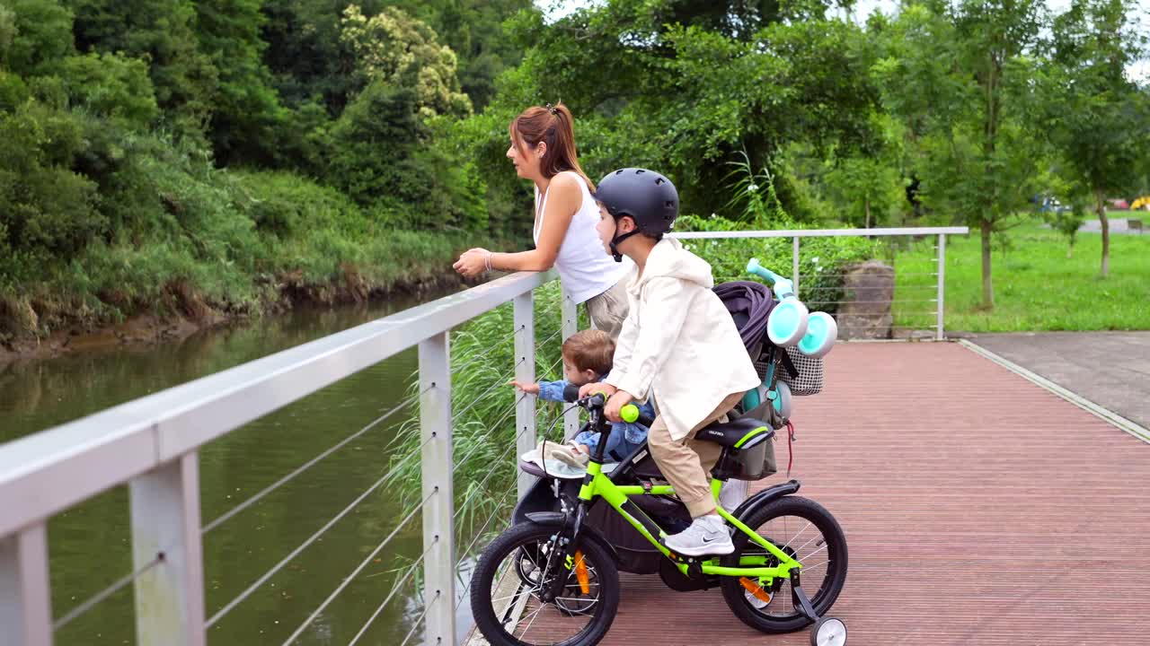 Family on a bike ride near a river
