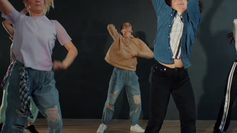 group of teens performing a dynamic dance routine