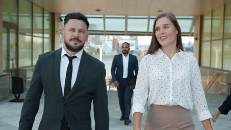 Business People Walking and Talking Outdoors