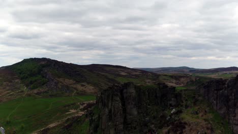 Aerial-view-over-flying-the-Roaches-landmark-located-in-the-Peak-District-national-park,-Staffordshire,-England