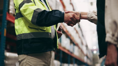 handshake in a warehouse