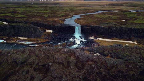 drone shot of oxarafoss waterfall in iceland