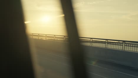 beautiful sunset shot from inside moving car while moving