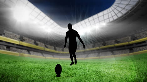 animation of silhouette of rugby player kicking ball over empty stands in sports stadium