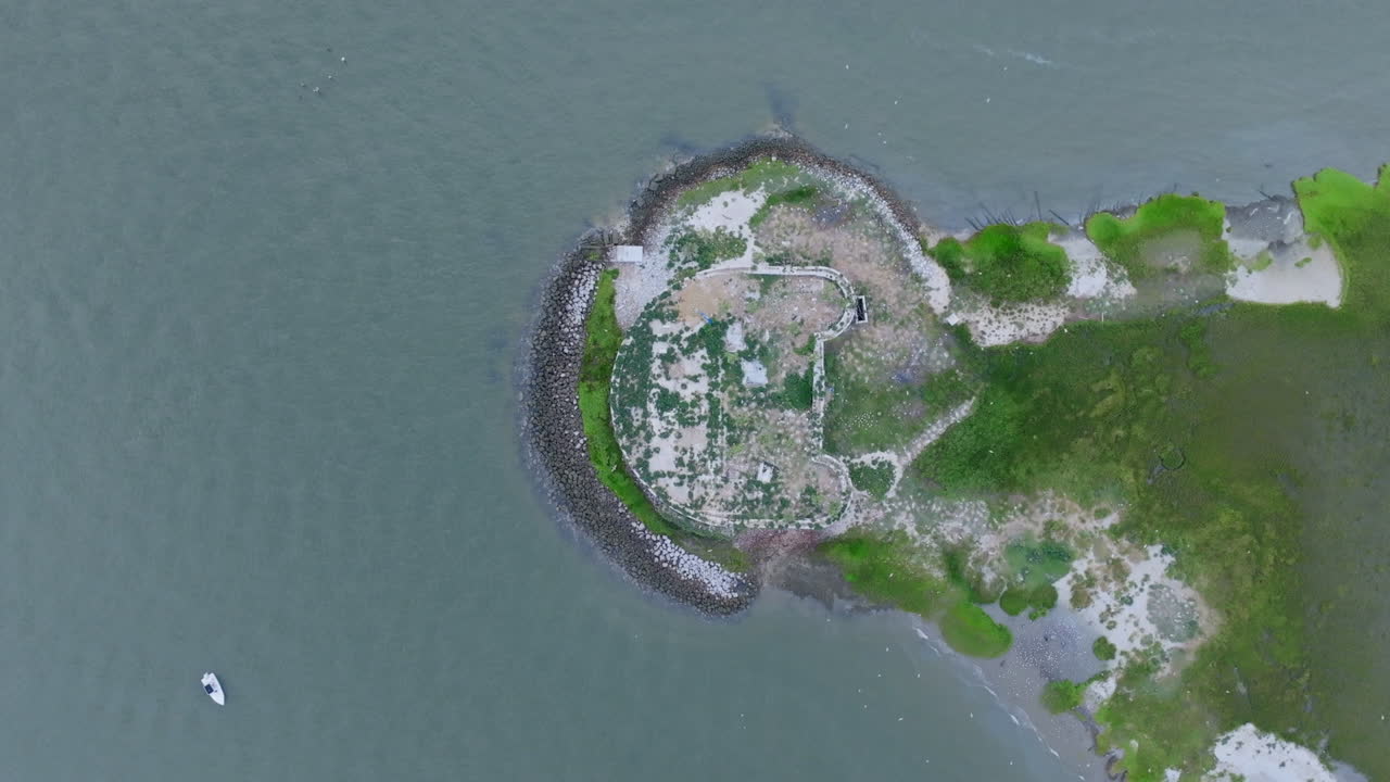 Aerial view of historic island ruins in coastal waters