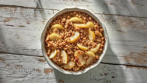 delicious homemade pear crumble in rustic white dish