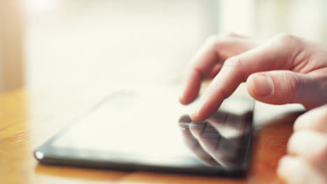 man-using-tablet-computer-close-up