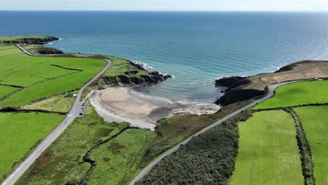 aerial coast of ireland the sheltered little kilmurrin cove copper coast waterford a safe place foe swimmers on a bright summer day