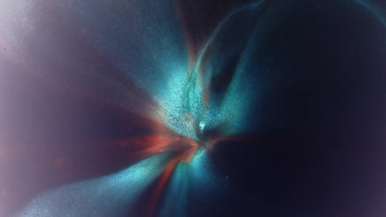 Cyan and red inks spread from a bright central point, forming soft aurora-like rays in close-up ink reaction.
