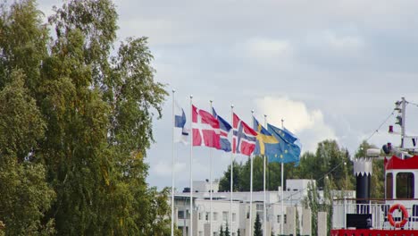 scandinavian flags in the wind - jyväskylä, finland