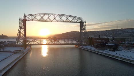 winter sunset at duluth, minnesota superior wisconsin. canal park bridge