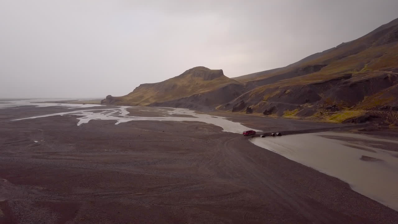 Icelandic River and Mountain Landscape with Vehicle